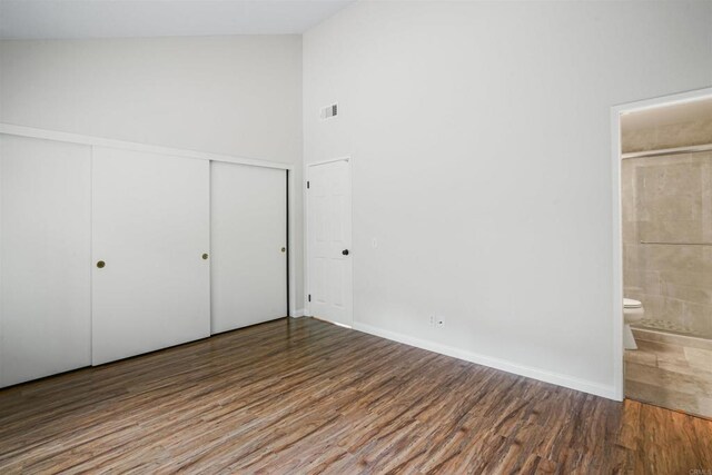 915 Lake Ridge Dr, San Marcos, CA 92078 - unfurnished bedroom with wood finished floors, ensuite bath, a closet, and high vaulted ceiling