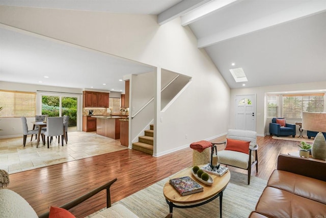 915 Lake Ridge Dr, San Marcos, CA 92078 - living room with beam ceiling, stairs, recessed lighting, a skylight, and high vaulted ceiling