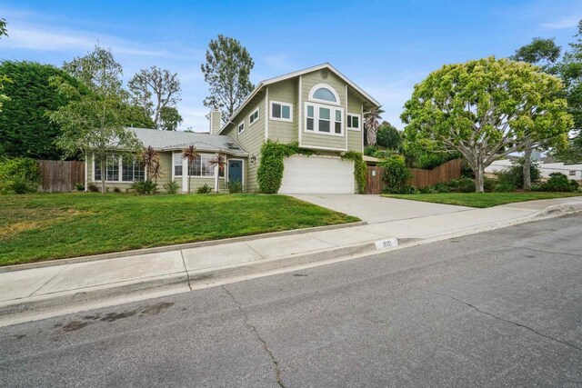 915 Lake Ridge Dr, San Marcos, CA 92078 - traditional-style home featuring concrete driveway, an attached garage, and a chimney