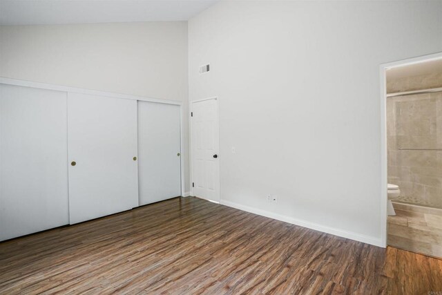 915 Lake Ridge Dr, San Marcos, CA 92078 - unfurnished bedroom featuring wood finished floors, connected bathroom, a closet, and high vaulted ceiling