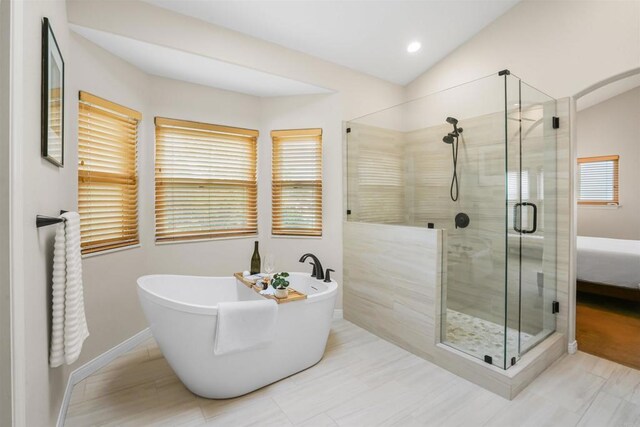 915 Lake Ridge Dr, San Marcos, CA 92078 - bathroom featuring a stall shower, a freestanding tub, and vaulted ceiling
