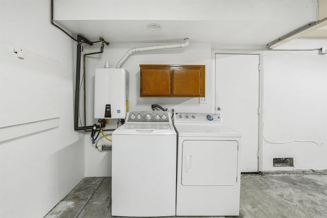 915 Lake Ridge Dr, San Marcos, CA 92078 - laundry room featuring tankless water heater, washer and clothes dryer, and cabinet space