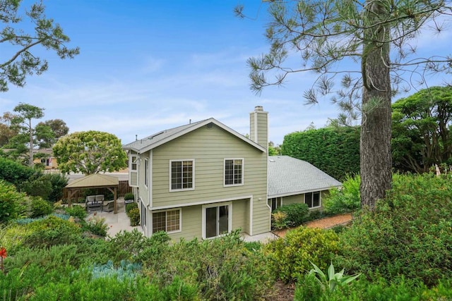 915 Lake Ridge Dr, San Marcos, CA 92078 - back of house with a gazebo, a patio, and a chimney