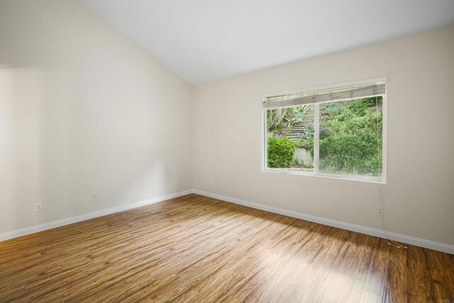 915 Lake Ridge Dr, San Marcos, CA 92078 - empty room featuring wood finished floors and lofted ceiling