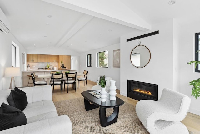 2058 Montgomery Ave, Cardiff By The Sea, CA 92007 - living room with a glass covered fireplace, light wood-style flooring, a wall mounted air conditioner, and recessed lighting