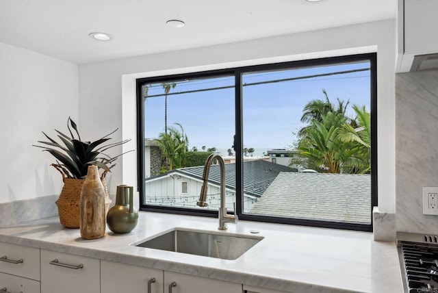 2058 Montgomery Ave, Cardiff By The Sea, CA 92007 - kitchen with white cabinetry and light stone countertops
