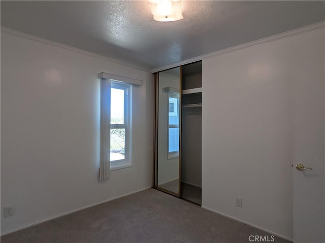 639 Scottdale Ave, Glendora, CA 91740 - unfurnished bedroom featuring a textured ceiling, carpet floors, a closet, and ornamental molding