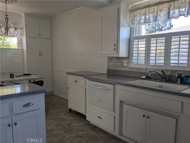 639 Scottdale Ave, Glendora, CA 91740 - kitchen with white cabinetry, a chandelier, crown molding, hanging light fixtures, and dark flooring