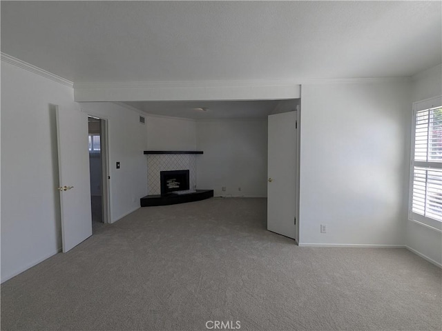 639 Scottdale Ave, Glendora, CA 91740 - unfurnished living room with carpet flooring, plenty of natural light, crown molding, and a tile fireplace