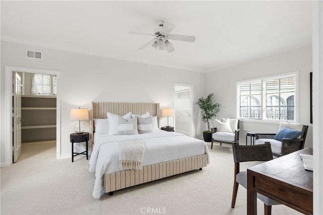7 Belmont, Newport Beach, CA 92660 - bedroom with a spacious closet, light carpet, multiple windows, and ornamental molding