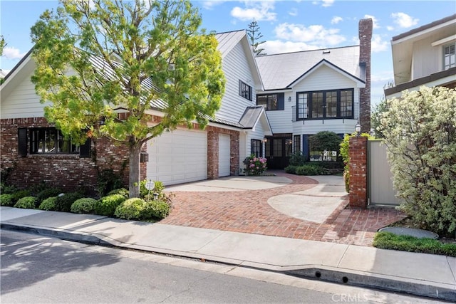 7 Belmont, Newport Beach, CA 92660 - view of front of home with brick siding and decorative driveway