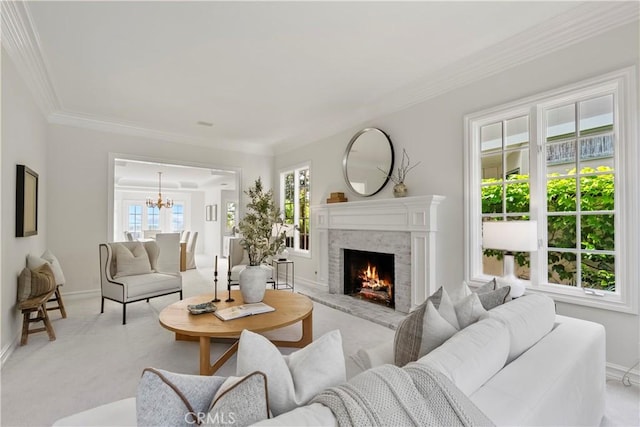 7 Belmont, Newport Beach, CA 92660 - living area with a chandelier, a warm lit fireplace, light colored carpet, and ornamental molding