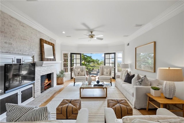7 Belmont, Newport Beach, CA 92660 - living area with wood finished floors, a brick fireplace, a ceiling fan, ornamental molding, and brick wall