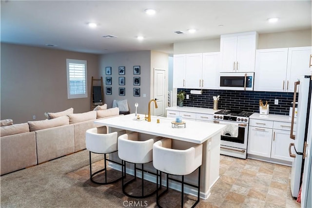 4098 Summer Way, Corona, CA 92883 - kitchen featuring white appliances, open floor plan, light countertops, white cabinets, and recessed lighting
