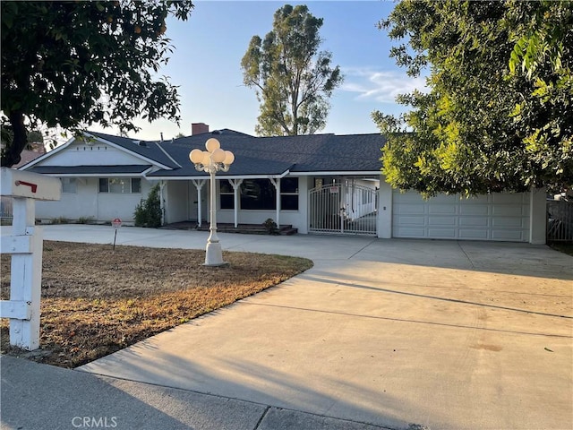 18295 Aguiro St, Rowland Heights, CA 91748 - ranch-style home with concrete driveway, a garage, a shingled roof, and a chimney