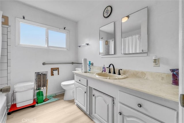 18295 Aguiro St, Rowland Heights, CA 91748 - full bath featuring vanity, wood finished floors, a shower with curtain, and a tub to relax in