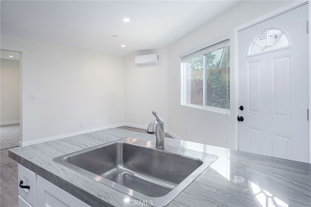 4781 Kona Kove Way, Yorba Linda, CA 92886 - kitchen with a wall unit AC, white cabinetry, and recessed lighting
