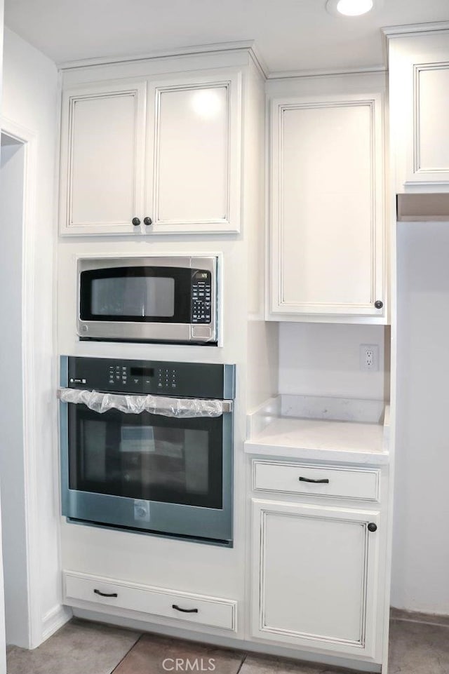 4781 Kona Kove Way, Yorba Linda, CA 92886 - kitchen with appliances with stainless steel finishes, white cabinets, and light countertops