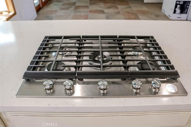 4781 Kona Kove Way, Yorba Linda, CA 92886 - kitchen view of stainless steel gas cooktop and stone countertops