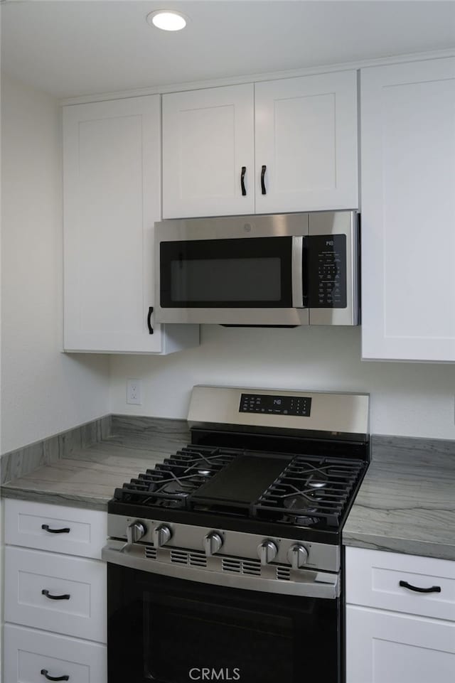 4781 Kona Kove Way, Yorba Linda, CA 92886 - kitchen featuring stainless steel appliances, white cabinetry, light countertops, and recessed lighting