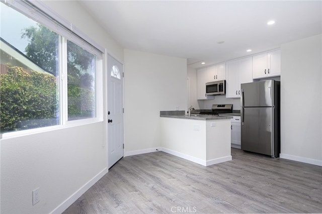 4781 Kona Kove Way, Yorba Linda, CA 92886 - kitchen featuring stainless steel appliances, white cabinetry, light wood finished floors, a peninsula, and recessed lighting