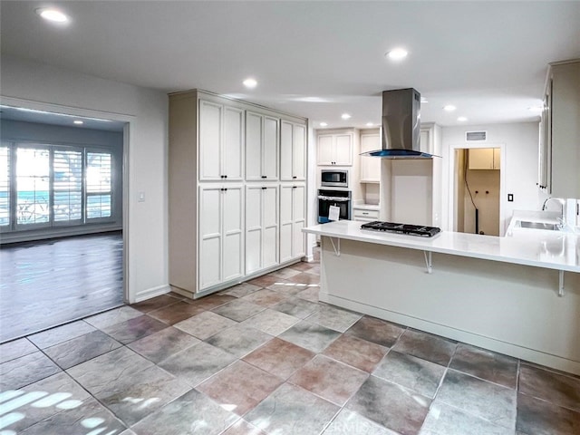 4781 Kona Kove Way, Yorba Linda, CA 92886 - kitchen featuring wall chimney range hood, stainless steel appliances, a peninsula, recessed lighting, and a kitchen bar
