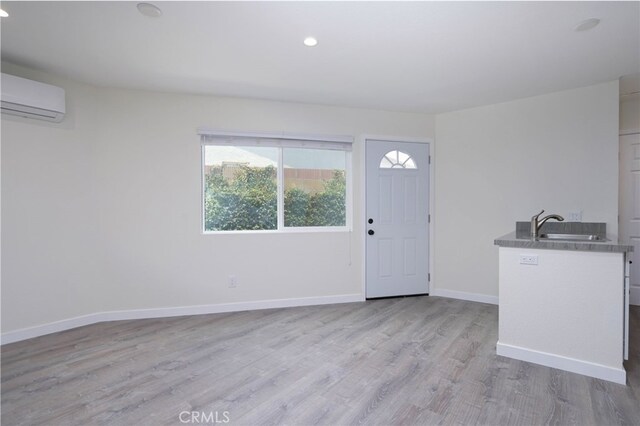 4781 Kona Kove Way, Yorba Linda, CA 92886 - foyer featuring a wall mounted AC, wood finished floors, and recessed lighting