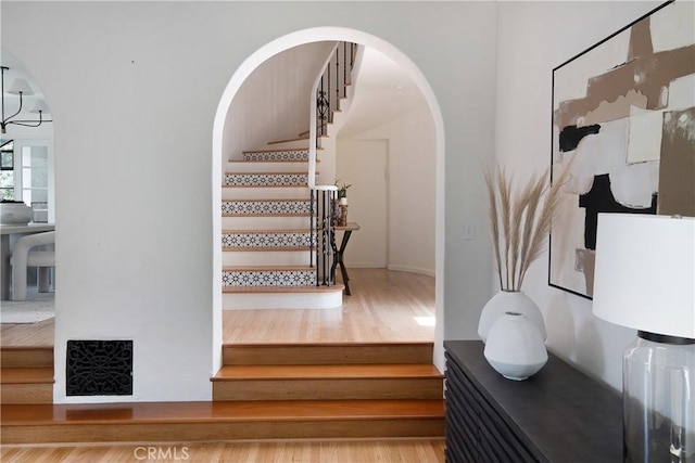 2982 Edgewick Rd, Glendale, CA 91206 - stairway featuring arched walkways and wood finished floors