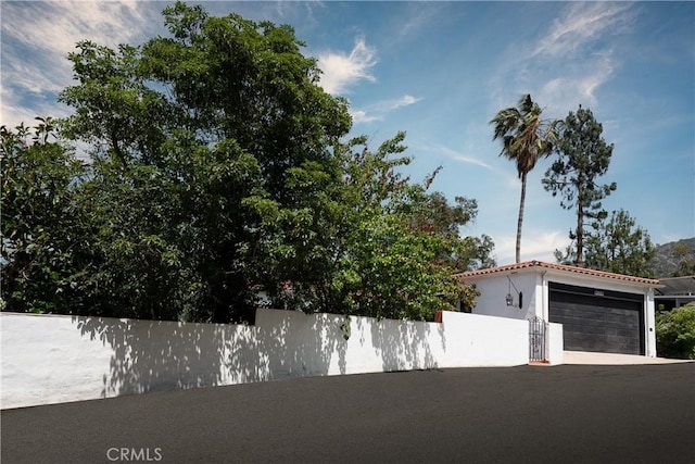2982 Edgewick Rd, Glendale, CA 91206 - view of front of home featuring a garage, stucco siding, a tile roof, and concrete driveway
