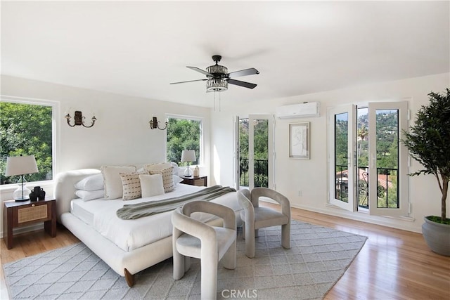 2982 Edgewick Rd, Glendale, CA 91206 - bedroom featuring multiple windows, a wall mounted AC, and light wood-type flooring
