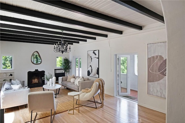 2982 Edgewick Rd, Glendale, CA 91206 - living area featuring wood finished floors, beamed ceiling, a fireplace, and a chandelier