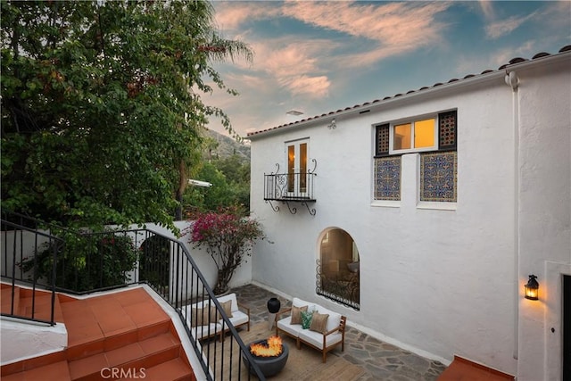 2982 Edgewick Rd, Glendale, CA 91206 - back of house featuring a balcony, stucco siding, and an outdoor fire pit