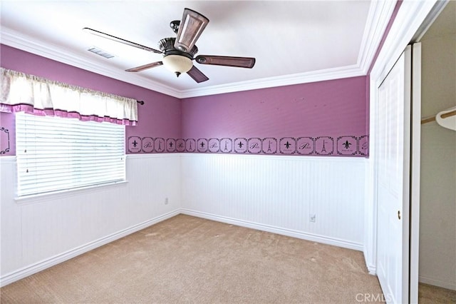 14145 Prairie Creek Pl, Eastvale, CA 92880 - carpeted empty room featuring wainscoting, ornamental molding, and ceiling fan