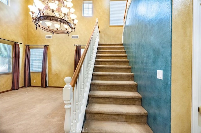 14145 Prairie Creek Pl, Eastvale, CA 92880 - stairs with a chandelier and carpet flooring