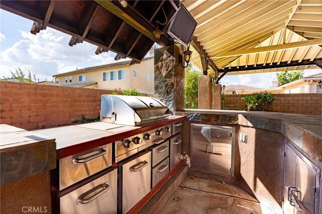 14145 Prairie Creek Pl, Eastvale, CA 92880 - view of patio with an outdoor kitchen