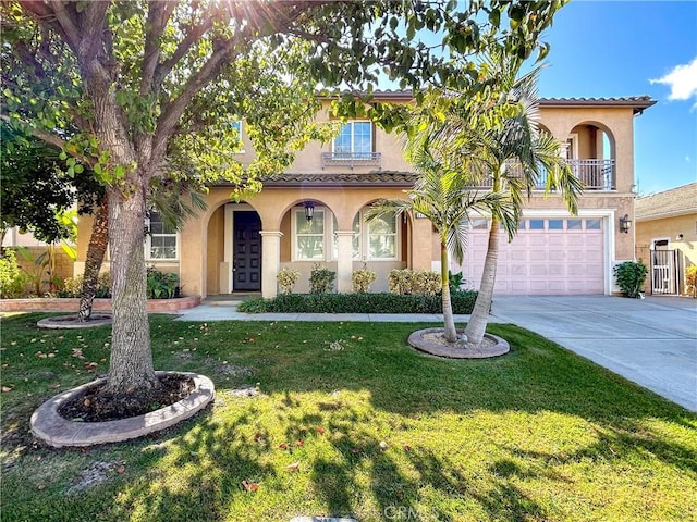 14145 Prairie Creek Pl, Eastvale, CA 92880 - mediterranean / spanish-style home with stucco siding, concrete driveway, an attached garage, and a front yard