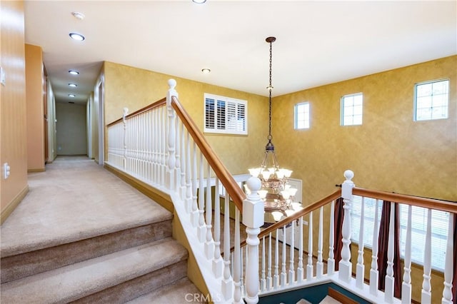 14145 Prairie Creek Pl, Eastvale, CA 92880 - staircase featuring a chandelier, recessed lighting, and carpet floors