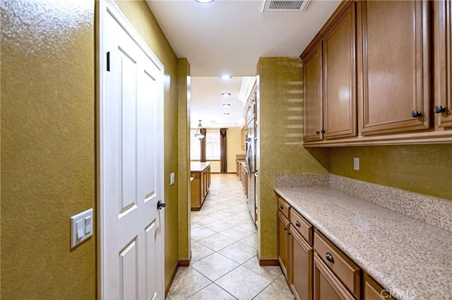 14145 Prairie Creek Pl, Eastvale, CA 92880 - hall with light tile patterned floors and recessed lighting