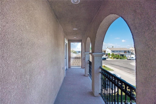 14145 Prairie Creek Pl, Eastvale, CA 92880 - exterior space featuring arched walkways, an upstairs landing, and a residential view
