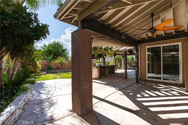 14145 Prairie Creek Pl, Eastvale, CA 92880 - fenced backyard featuring a ceiling fan and a patio