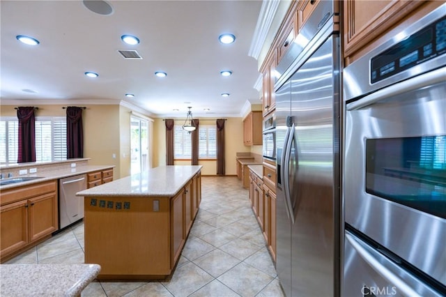 14145 Prairie Creek Pl, Eastvale, CA 92880 - kitchen with stainless steel appliances, ornamental molding, a kitchen island, recessed lighting, and light tile patterned floors
