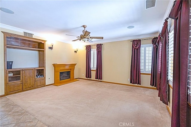 14145 Prairie Creek Pl, Eastvale, CA 92880 - unfurnished living room featuring crown molding, ceiling fan, a glass covered fireplace, carpet, and tile patterned floors