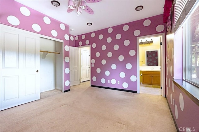 14145 Prairie Creek Pl, Eastvale, CA 92880 - unfurnished bedroom featuring light colored carpet, wallpapered walls, a closet, and connected bathroom