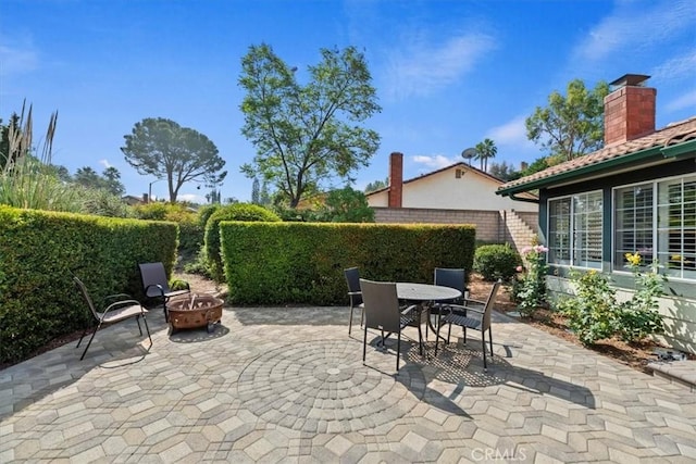 6807 Wilding Pl, Riverside, CA 92506 - view of patio with an outdoor fire pit and outdoor dining space