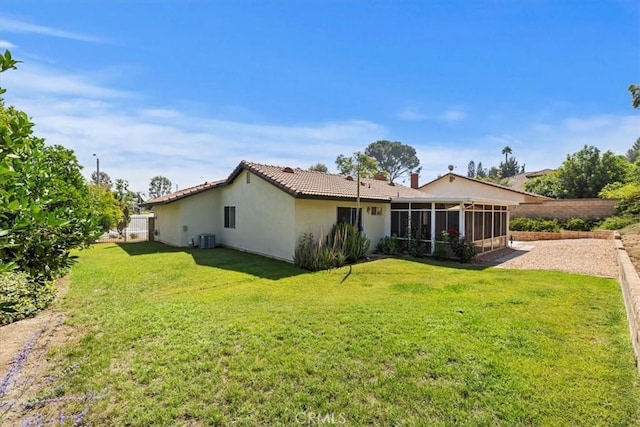 6807 Wilding Pl, Riverside, CA 92506 - back of property with a sunroom, stucco siding, and a tiled roof