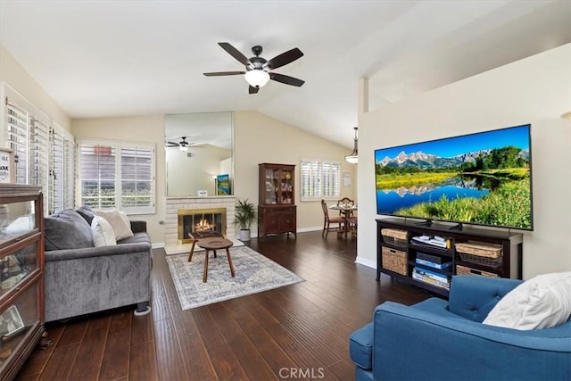 6807 Wilding Pl, Riverside, CA 92506 - living room with ceiling fan, lofted ceiling, a brick fireplace, and wood finished floors