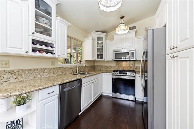 6807 Wilding Pl, Riverside, CA 92506 - kitchen featuring appliances with stainless steel finishes, white cabinets, and dark wood finished floors