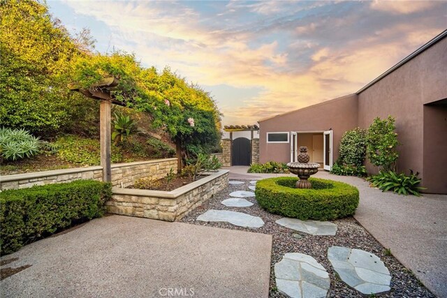32131 Sea Island Dr, Dana Point, CA 92629 - yard at dusk featuring a patio area and a gate