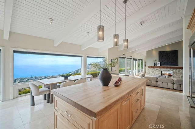 32131 Sea Island Dr, Dana Point, CA 92629 - kitchen with butcher block counters, light brown cabinetry, hanging light fixtures, wood ceiling, and light tile patterned floors