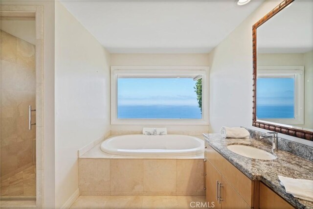 32131 Sea Island Dr, Dana Point, CA 92629 - full bathroom with a garden tub, vanity, a stall shower, and tile patterned floors